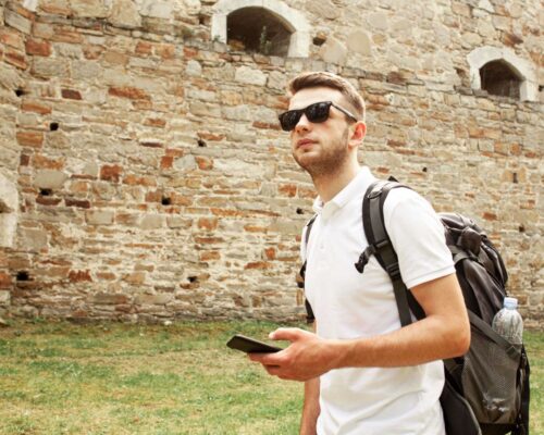 man-with-sunglasses-castle-ruins